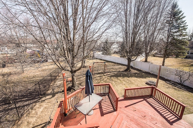 wooden deck featuring a fenced backyard