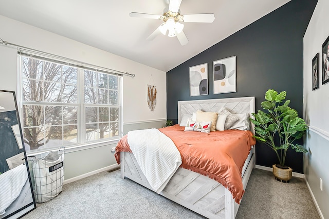 bedroom with baseboards, ceiling fan, carpet flooring, and vaulted ceiling