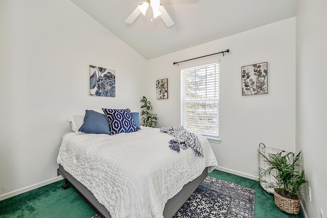 bedroom with carpet flooring, ceiling fan, baseboards, and vaulted ceiling