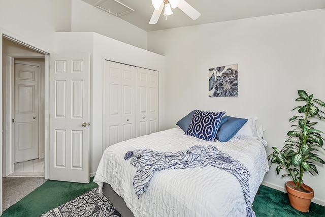 bedroom with a closet, dark carpet, baseboards, and a ceiling fan