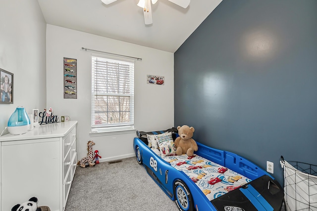 bedroom with visible vents, baseboards, carpet, lofted ceiling, and a ceiling fan