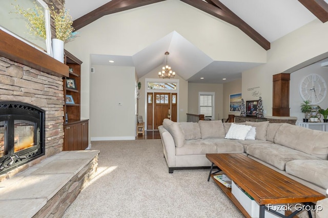 living area featuring carpet, high vaulted ceiling, beam ceiling, a stone fireplace, and a notable chandelier