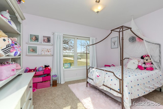 bedroom featuring carpet flooring and baseboards