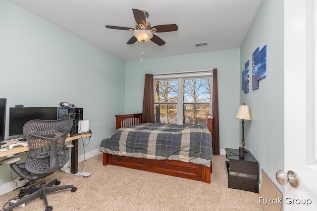 carpeted bedroom featuring a ceiling fan, baseboards, and visible vents