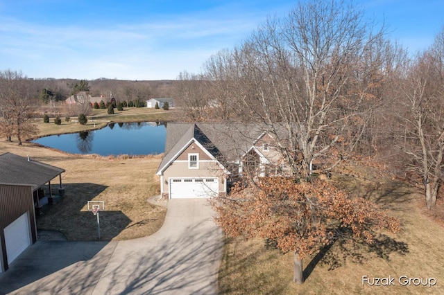 birds eye view of property featuring a water view