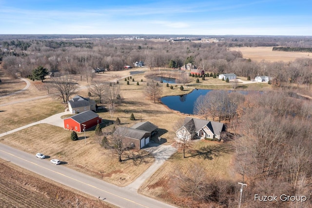 drone / aerial view featuring a water view and a rural view