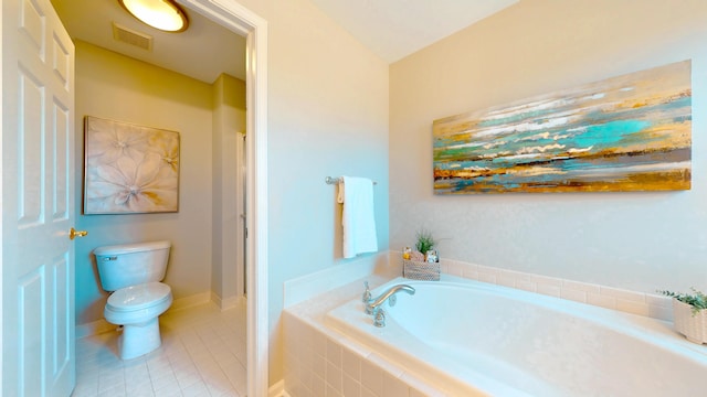 bathroom featuring visible vents, baseboards, toilet, a garden tub, and tile patterned floors