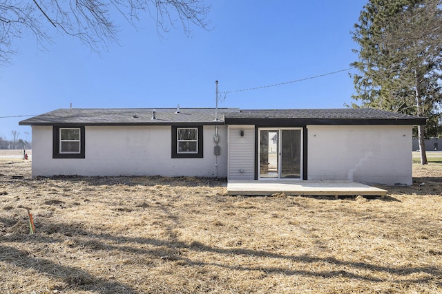 rear view of house with a wooden deck