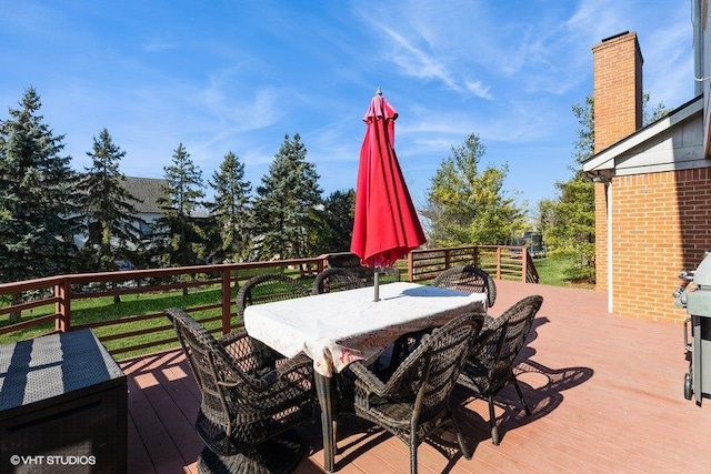 wooden terrace featuring outdoor dining space