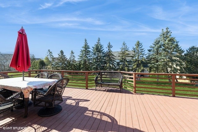 wooden deck with outdoor dining space