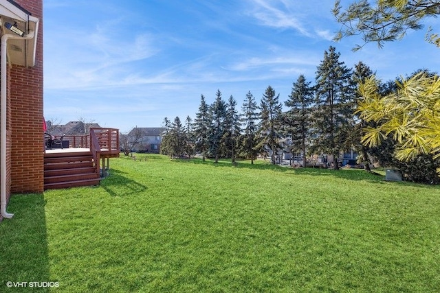 view of yard with a deck