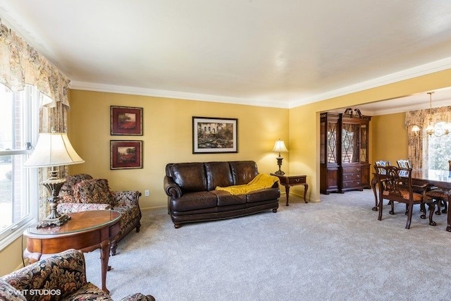 living area with a notable chandelier, crown molding, baseboards, and carpet floors