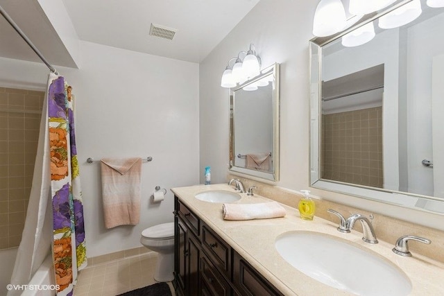 full bathroom featuring a sink, visible vents, toilet, and double vanity