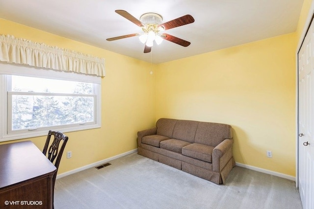 office featuring visible vents, carpet flooring, baseboards, and a ceiling fan