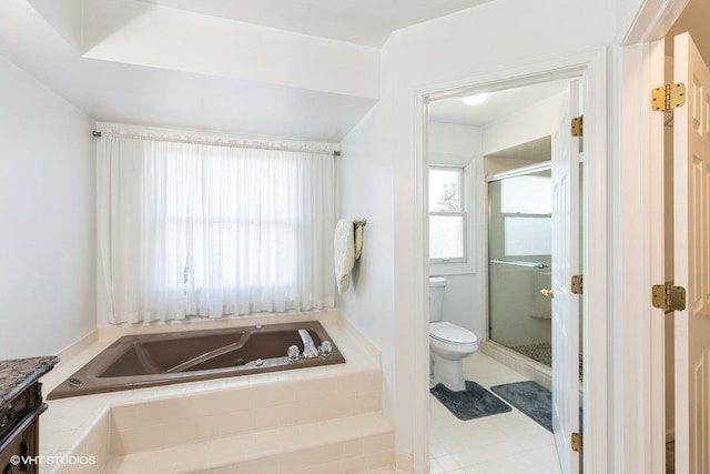 full bathroom featuring a bath, a stall shower, toilet, and vanity