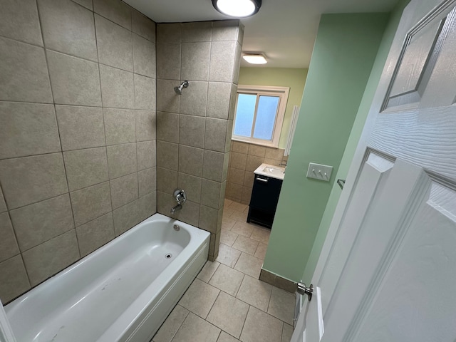 full bathroom with tile patterned flooring, vanity, and washtub / shower combination