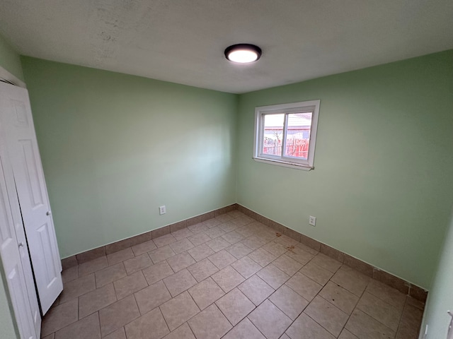 unfurnished bedroom featuring baseboards