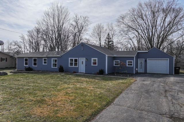 single story home featuring aphalt driveway, a garage, a shingled roof, and a front yard