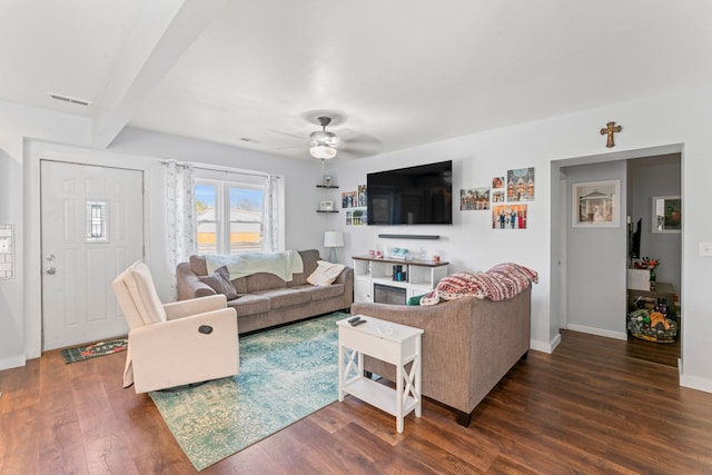 living area with visible vents, beam ceiling, wood finished floors, baseboards, and ceiling fan