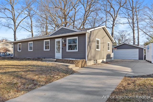 view of front of property with an outdoor structure, a front lawn, and a detached garage