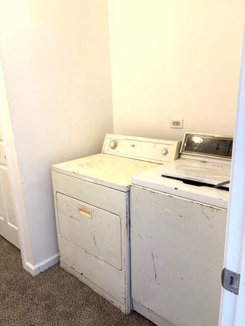 laundry room featuring laundry area, washing machine and dryer, baseboards, and carpet floors