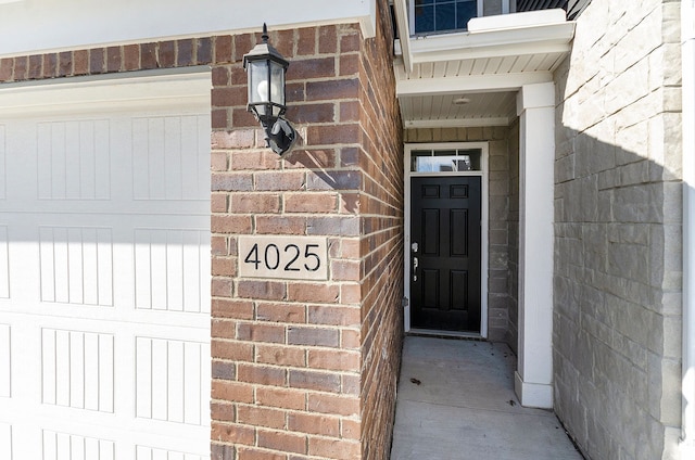 entrance to property with brick siding