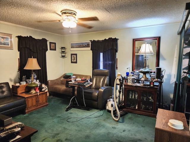 living area featuring carpet floors, a textured ceiling, and ceiling fan