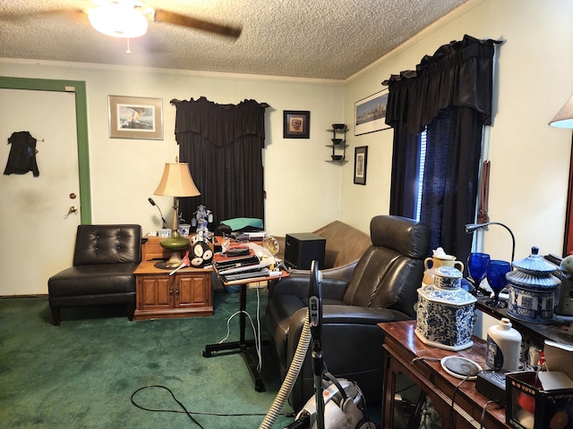 carpeted living area with a textured ceiling, ceiling fan, and ornamental molding