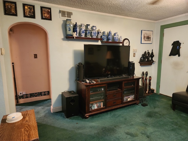 carpeted living area featuring visible vents, arched walkways, a textured ceiling, and ornamental molding