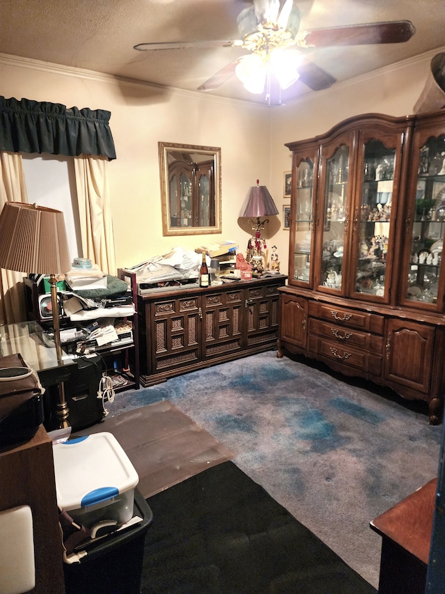 misc room featuring a textured ceiling, a ceiling fan, and carpet floors