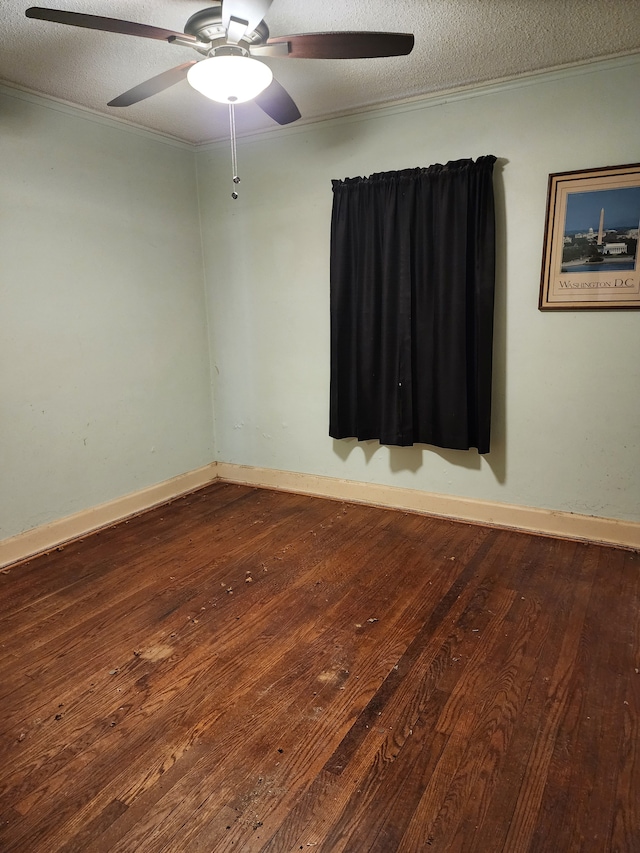 empty room featuring crown molding, hardwood / wood-style flooring, a ceiling fan, and a textured ceiling