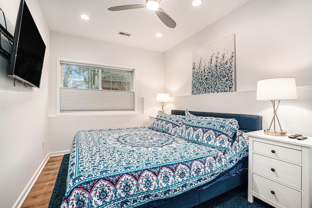 bedroom featuring recessed lighting, wood finished floors, visible vents, and baseboards