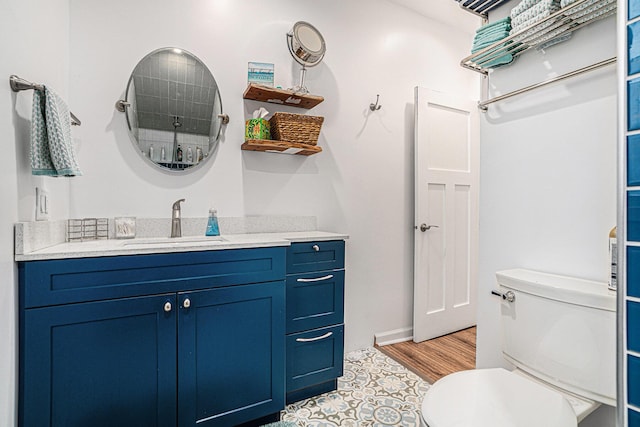 bathroom with toilet and vanity