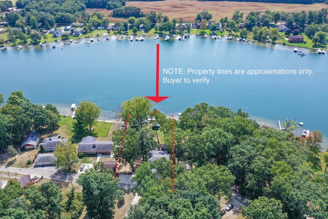 birds eye view of property with a water view