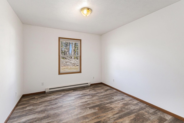 unfurnished room featuring baseboards, baseboard heating, wood finished floors, and a textured ceiling