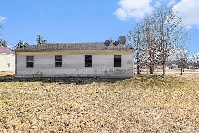 rear view of house with a lawn