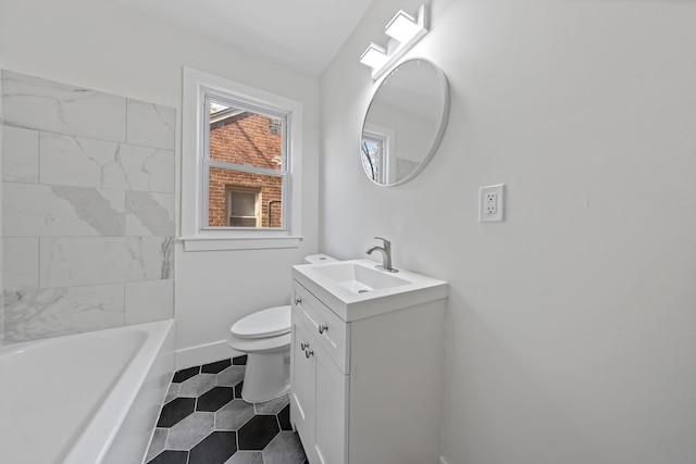 full bath featuring a washtub, tile patterned flooring, vanity, baseboards, and toilet