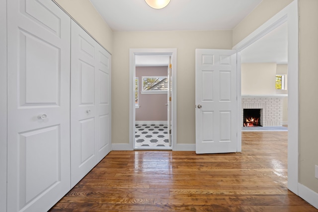 interior space with baseboards and wood finished floors