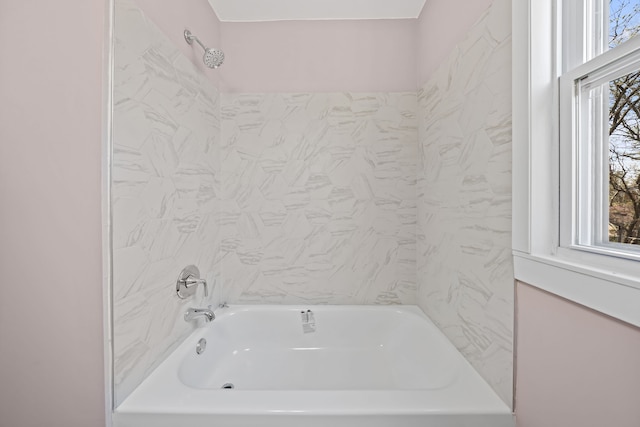 bathroom with shower / washtub combination