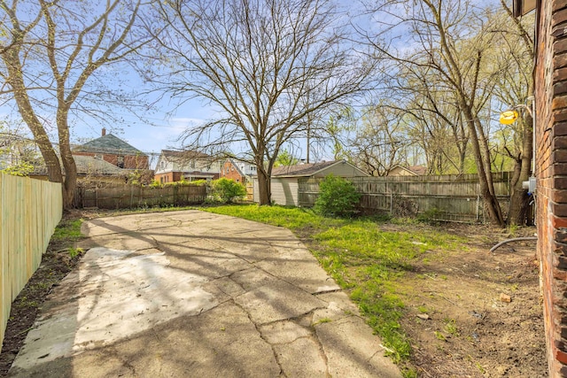 view of yard with a patio and a fenced backyard