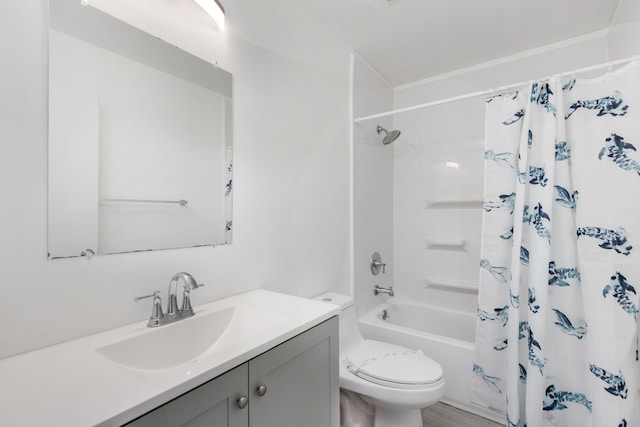 bathroom featuring shower / tub combo with curtain, vanity, and toilet