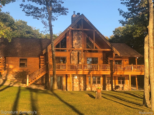 10924 E Grand Lake Rd, Presque Isle, MI 49777 - back of house featuring a chimney, log exterior, a yard, and a wooden deck