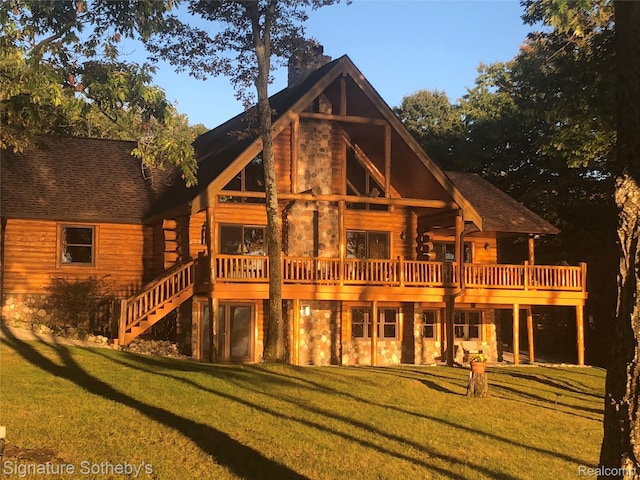 10924 E Grand Lake Rd, Presque Isle, MI 49777 - rear view of property featuring stone siding, a lawn, and a wooden deck