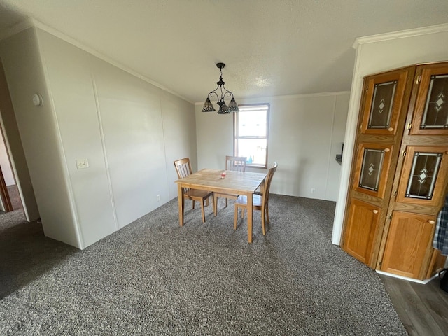 dining area featuring a notable chandelier and ornamental molding