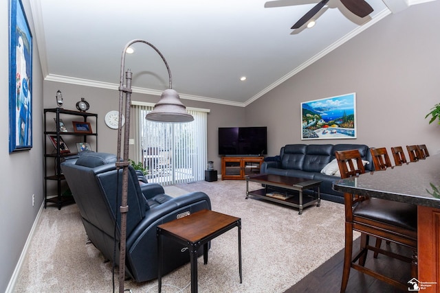 living room featuring ceiling fan, lofted ceiling, light colored carpet, and ornamental molding