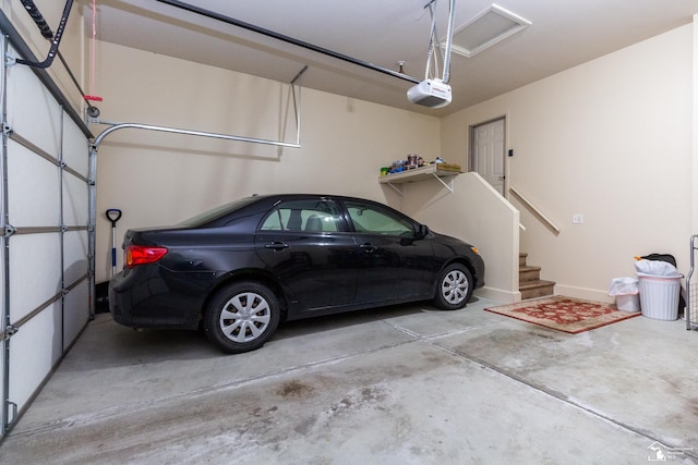 garage featuring a garage door opener