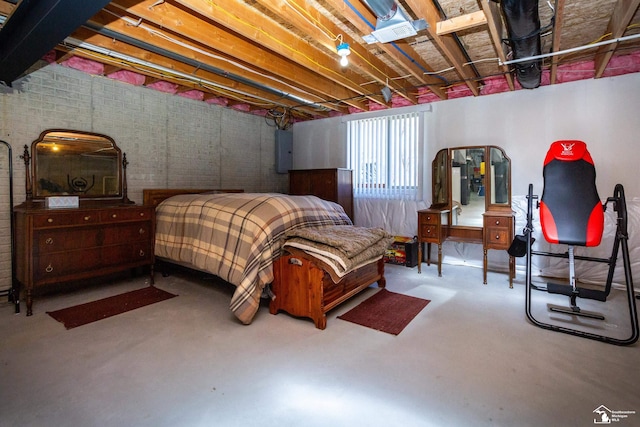 bedroom with electric panel and finished concrete floors