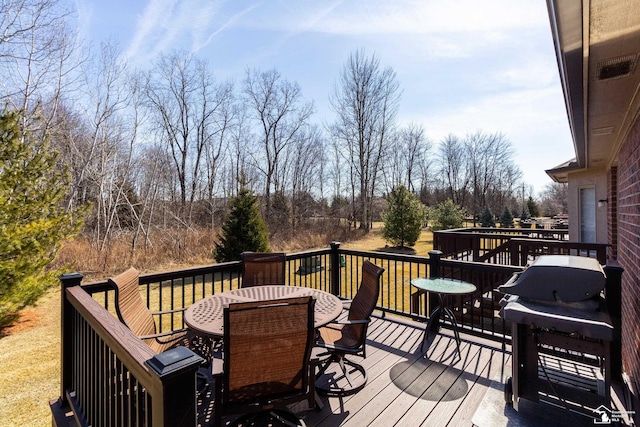 wooden deck with outdoor dining area