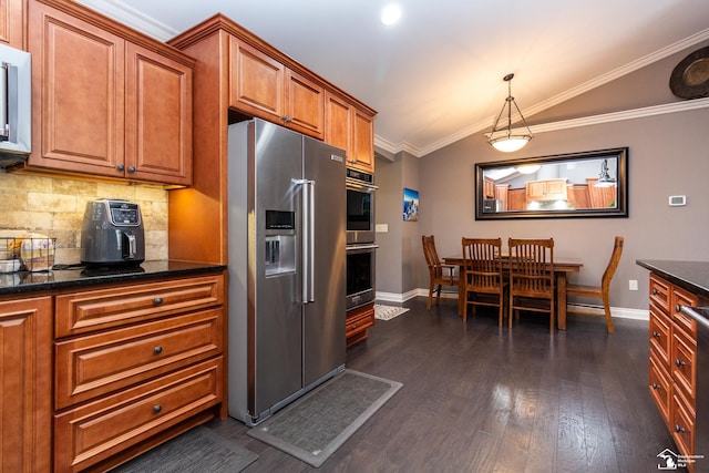 kitchen with dark wood finished floors, ornamental molding, decorative backsplash, stainless steel appliances, and brown cabinets