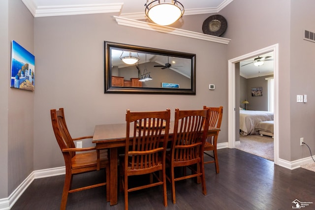 dining space with baseboards, wood finished floors, a ceiling fan, and crown molding